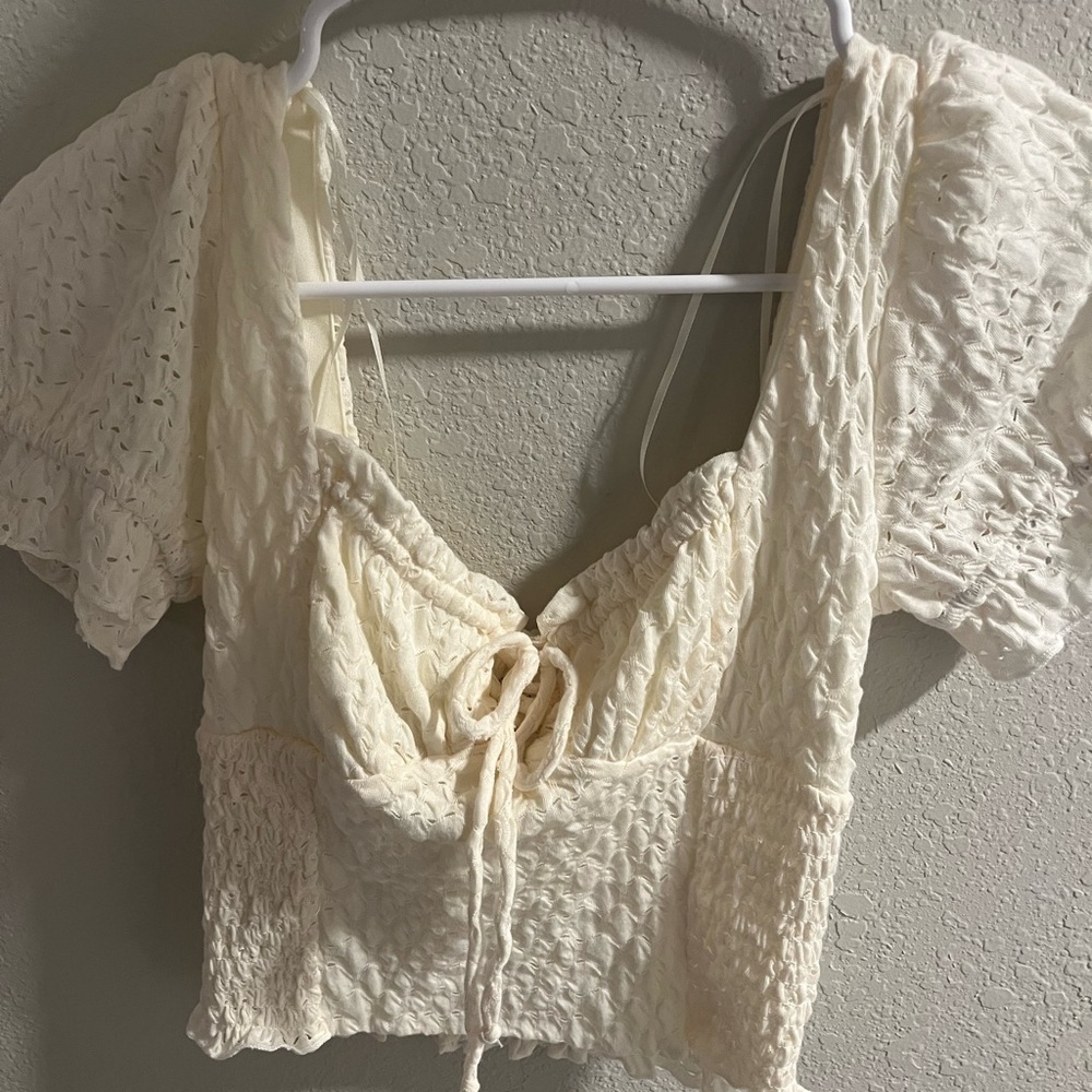 Cream ruffle sleeve blouse